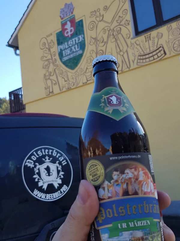 Polsterbräu bottle in front of a historic building in Nankendorf